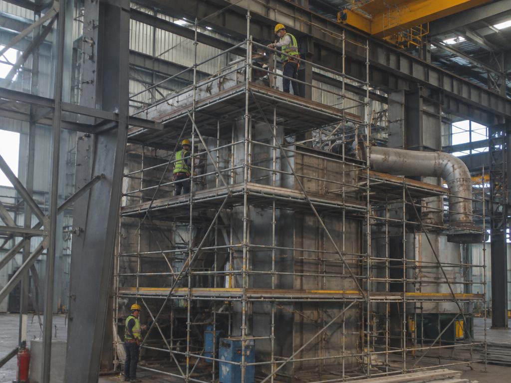 Scaffolding set up inside an industrial shed for maintenance work