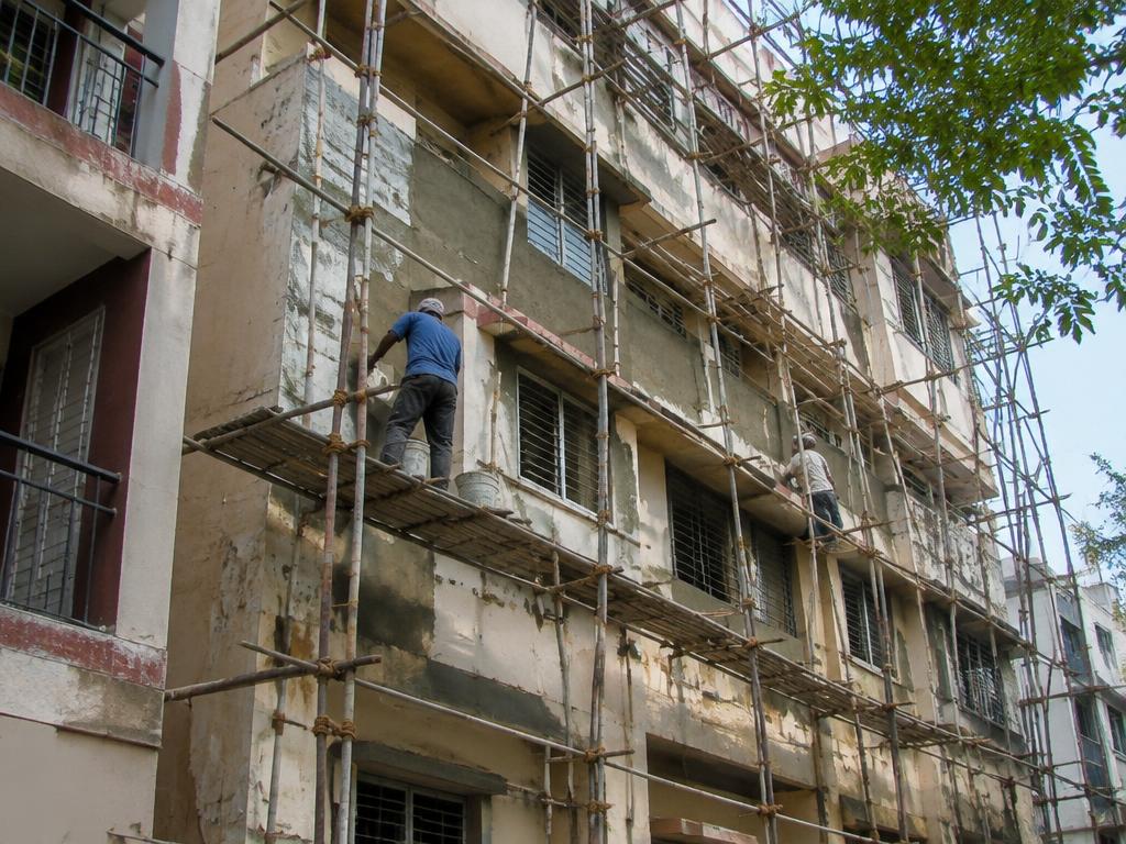 Scaffolding on an older apartment building during plaster renovation